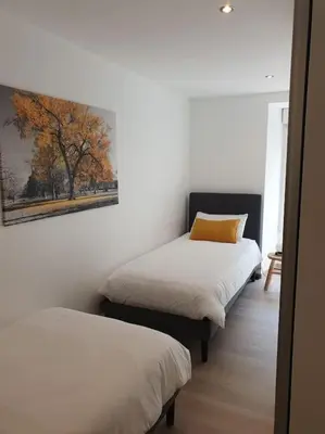 Un ou plusieurs lits dans un hébergement de l'établissement Gîte Manoir de Kerlez Plain-pied