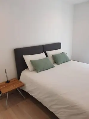 Un ou plusieurs lits dans un hébergement de l'établissement Gîte Manoir de Kerlez Plain-pied
