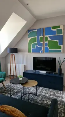 Télévision ou salle de divertissement dans l'établissement Le Duplex, proche centre-ville
