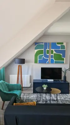 Télévision ou salle de divertissement dans l'établissement Le Duplex, proche centre-ville