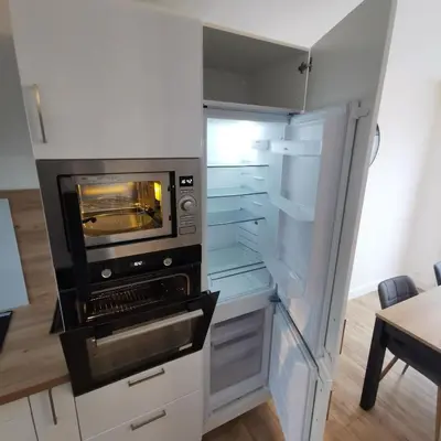 Cuisine ou kitchenette dans l'établissement TYVAC - Maison centre Plougasnou 2 chambres- 4 voyageurs