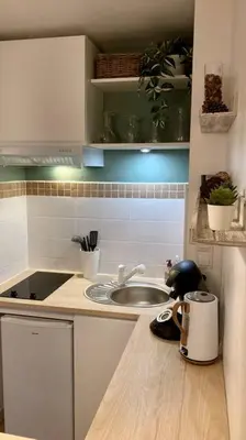 Cuisine ou kitchenette dans l'établissement Cozy’Wood