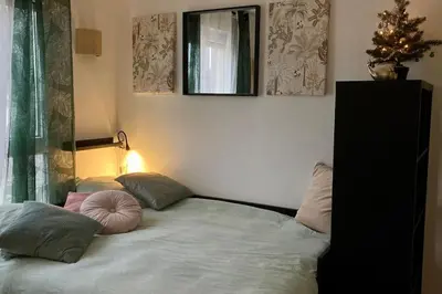 Un ou plusieurs lits dans un hébergement de l'établissement Cozy’Wood