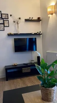 Télévision ou salle de divertissement dans l'établissement Cozy’Wood