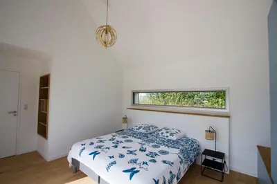 Un ou plusieurs lits dans un hébergement de l'établissement Tipoz'Immo - Ti Marin 500m de la plage et restaurant à pied - linge inclus et lits faits - wifi inclus - grande terrasse plein sud - spacieuse - lumineuse