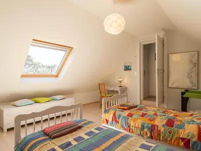 Un ou plusieurs lits dans un hébergement de l'établissement Holiday Home La maison de Toul an Dour by Interhome