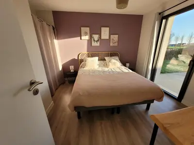 Un ou plusieurs lits dans un hébergement de l'établissement Un petit coin de paradis