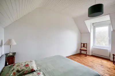 Un ou plusieurs lits dans un hébergement de l'établissement Pays bigouden - Charmante maison en pierre pour 6