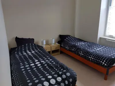 Un ou plusieurs lits dans un hébergement de l'établissement Appartement à 50m de la plage