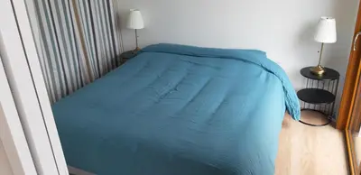 Un ou plusieurs lits dans un hébergement de l'établissement Vue Mer Très belle plage à pied Maison proche Lesconil Loctudy