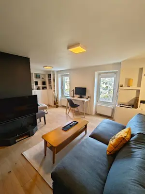 Télévision ou salle de divertissement dans l'établissement Les Hauts de Morlaix