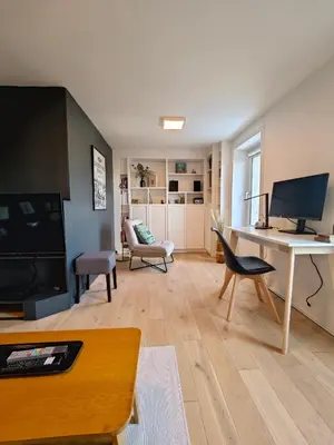 Télévision ou salle de divertissement dans l'établissement Les Hauts de Morlaix