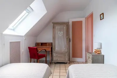 Un ou plusieurs lits dans un hébergement de l'établissement Jacinthe - Appt dans une villa néo-bretonne