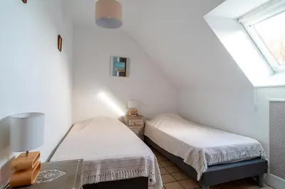 Un ou plusieurs lits dans un hébergement de l'établissement Jacinthe - Appt dans une villa néo-bretonne