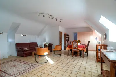 Coin salon dans l'établissement Jacinthe - Appt dans une villa néo-bretonne