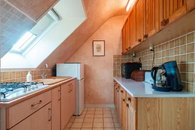Cuisine ou kitchenette dans l'établissement Jacinthe - Appt dans une villa néo-bretonne