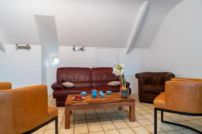 Coin salon dans l'établissement Jacinthe - Appt dans une villa néo-bretonne