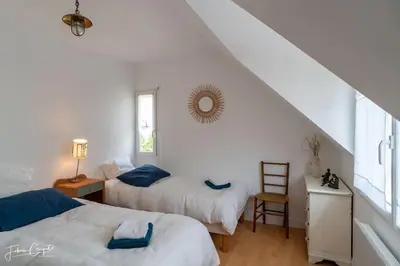Un ou plusieurs lits dans un hébergement de l'établissement TY GLAZ : la plage à 400 m, maison de charme