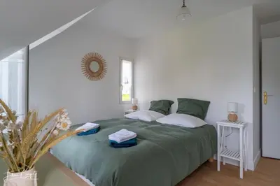 Un ou plusieurs lits dans un hébergement de l'établissement TY GLAZ : la plage à 400 m, maison de charme