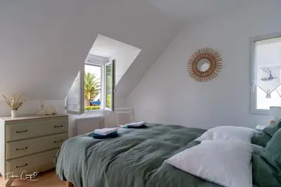 Un ou plusieurs lits dans un hébergement de l'établissement TY GLAZ : la plage à 400 m, maison de charme