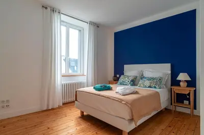 Un ou plusieurs lits dans un hébergement de l'établissement Ty Boca - Maison pour 6 avec jardin