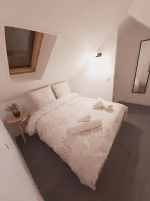 Un ou plusieurs lits dans un hébergement de l'établissement Duplex Cosy 1