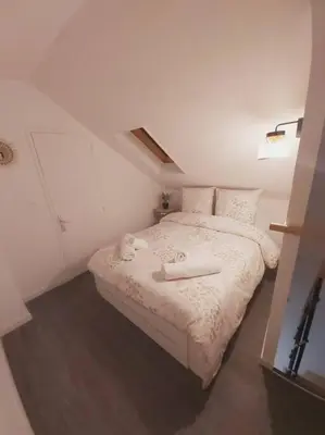 Un ou plusieurs lits dans un hébergement de l'établissement Duplex Cosy 1