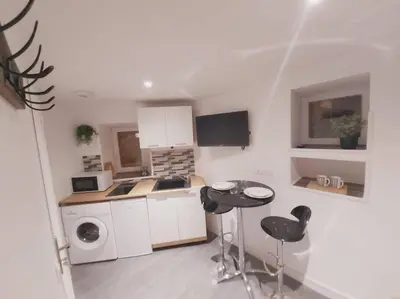 Cuisine ou kitchenette dans l'établissement Duplex Cosy 1