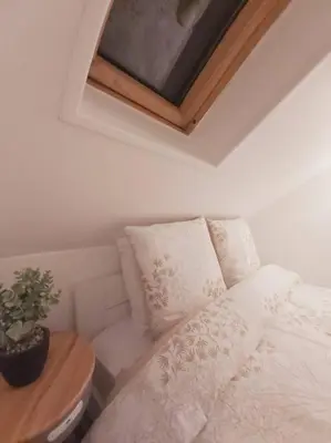 Un ou plusieurs lits dans un hébergement de l'établissement Duplex Cosy 1