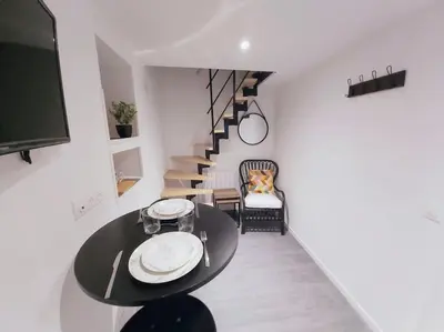 Télévision ou salle de divertissement dans l'établissement Duplex Cosy 1