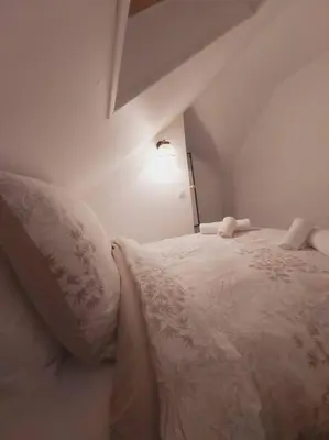 Un ou plusieurs lits dans un hébergement de l'établissement Duplex Cosy 1