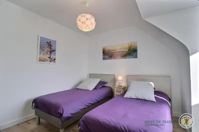 Un ou plusieurs lits dans un hébergement de l'établissement La maison de tredrez