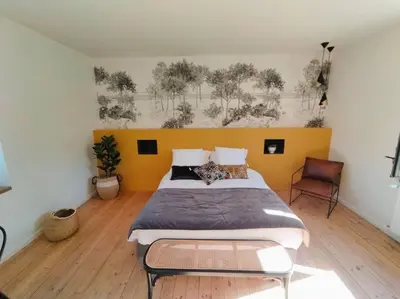 Un ou plusieurs lits dans un hébergement de l'établissement La Maison de Tante Yvonne - Gîte de Kerblaise