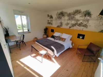 Un ou plusieurs lits dans un hébergement de l'établissement La Maison de Tante Yvonne - Gîte de Kerblaise