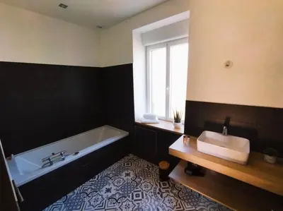 Un ou plusieurs lits dans un hébergement de l'établissement La Maison de Tante Yvonne - Gîte de Kerblaise