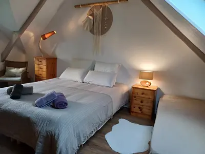 Un ou plusieurs lits dans un hébergement de l'établissement La maison au cœur de la forêt