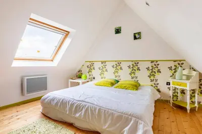 Un ou plusieurs lits dans un hébergement de l'établissement Le Domaine de Kerampape, gîte accessible, vignoble en Finistère sud