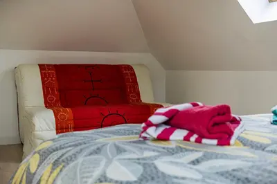 Un ou plusieurs lits dans un hébergement de l'établissement Maison à 2 pas des plages