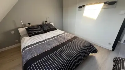 Un ou plusieurs lits dans un hébergement de l'établissement Maison à 2 pas des plages