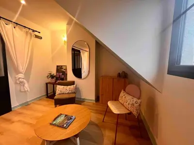 Un ou plusieurs lits dans un hébergement de l'établissement Appartement duplex rénové, plein bourg, vue mer