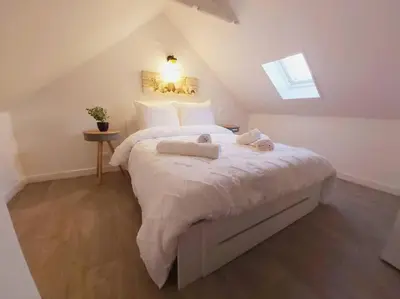 Un ou plusieurs lits dans un hébergement de l'établissement Duplex Cosy 2