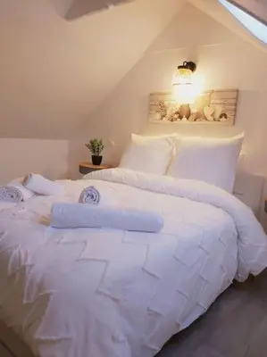 Un ou plusieurs lits dans un hébergement de l'établissement Duplex Cosy 2