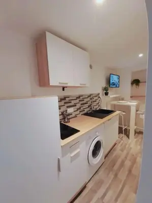 Cuisine ou kitchenette dans l'établissement Duplex Cosy 2