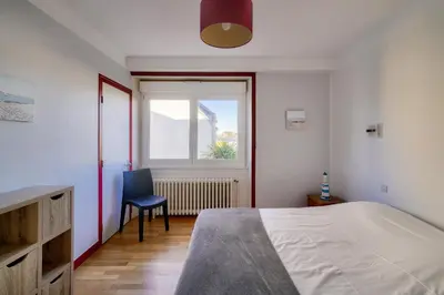 Un ou plusieurs lits dans un hébergement de l'établissement Vue sur le port - Maison pour 10 avec jardin