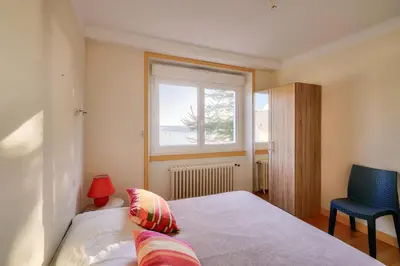 Un ou plusieurs lits dans un hébergement de l'établissement Vue sur le port - Maison pour 10 avec jardin