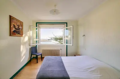 Un ou plusieurs lits dans un hébergement de l'établissement Vue sur le port - Maison pour 10 avec jardin