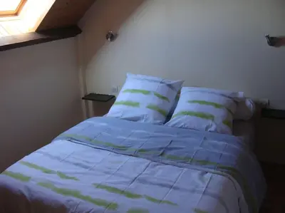 Un ou plusieurs lits dans un hébergement de l'établissement MAISON SUR TERRAIN CLOS MER IROISE