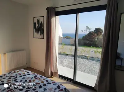 Un ou plusieurs lits dans un hébergement de l'établissement gîte le bel air face à la mer