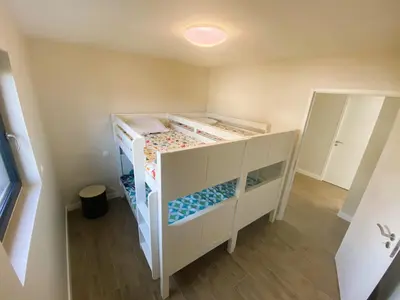 Un ou plusieurs lits dans un hébergement de l'établissement Fouesnant, superbe maison en bois, proche de la plage de Mousterlin