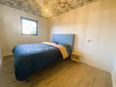 Un ou plusieurs lits dans un hébergement de l'établissement Fouesnant, superbe maison en bois, proche de la plage de Mousterlin